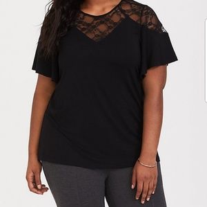 Torrid black top with lace neckline.